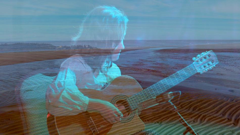 Image of a guitarist superimposed with an image of the ocean