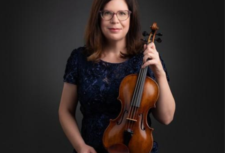 a woman poses holding a violin